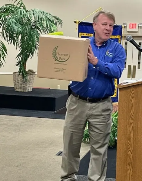 Brad Fleming holding a Harvest Pack box